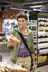 Image showing Portrait, man and customer shopping for apples, groceries and fresh goods in supermarket. Happy consumer, retail convenience store and grocery mall to purchase fruits, healthy vegan food and product