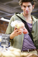 Image showing Portrait, man and shopping for fruits, groceries and fresh goods in supermarket, retail convenience store and mall. Consumer purchase apples, healthy vegan food or bag of grocery product on promotion