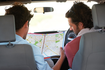 Image showing Road trip, men and car with map for travel, direction or adventure outdoor in nature to navigate. People, travelers or tourist in vehicle for vacation, holiday or tourism with searching destination