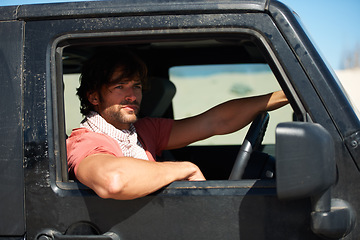 Image showing Man, car and driving for road trip, travel or holiday in outdoor journey or adventure in nature. Handsome or attractive male person or driver looking out window of vehicle in traveling, view or break