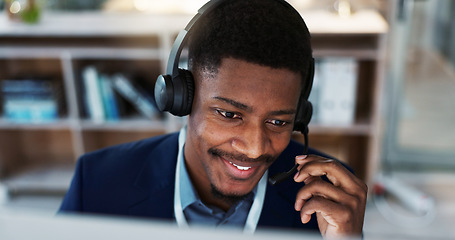 Image showing Happy black man, face and headphones in call center, customer service or telemarketing at office. Closeup of African male person, consultant or agent smile and talking for online advice at workplace