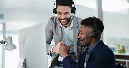 Image showing businessman, call center and team success at computer in customer service, telemarketing or support office. Fist bump, manager and consultant in training for online advice, celebrate or contact us