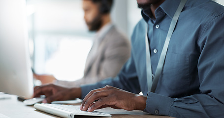 Image showing Keyboard, hands and businessman in the office typing for research on the internet for a project. Computer, technology and closeup of professional African male designer working on a pc in workplace.