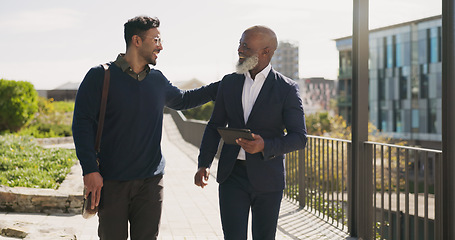 Image showing Walking, outdoor and business people with tablet, support and connection with planning, teamwork and partnership. Staff, manager and employee outside, tech and cooperation with digital app or talking