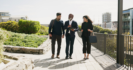 Image showing Outdoor, business people and leader with a tablet, planning and conversation with brainstorming. Staff, group and manager with employees, outside and technology with network, cooperation and teamwork