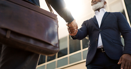 Image showing Handshake, city and business people in morning by building for career, job and work opportunity. Professional, teamwork and workers shaking hands for agreement, thank you and b2b deal for success