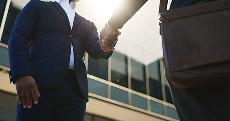 Image showing Handshake, city and business people in morning by building for career, job and work opportunity. Professional, teamwork and workers shaking hands for agreement, thank you and b2b deal for success