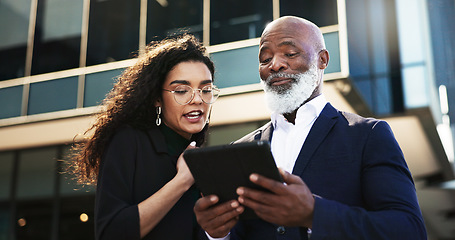 Image showing Tablet, talking and businesswoman with manager in the city planning a legal strategy. Discussion, digital technology and team of professional lawyers working on case in collaboration in urban town.