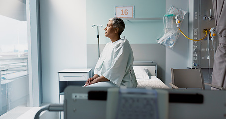 Image showing Sad, patient and thinking in hospital with window and stress, anxiety or fear of cancer, death and insurance. Senior, woman and depression in clinic with lady worried for future or mental health
