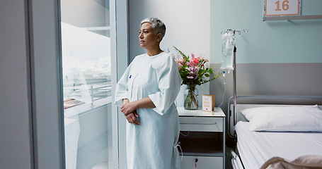 Image showing Sad, patient and thinking in hospital with window and stress, anxiety or fear of cancer, death and insurance. Senior, woman and depression in clinic with lady worried for future or mental health