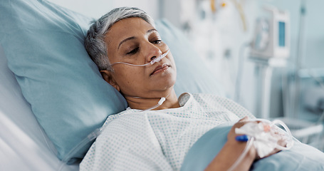 Image showing Sick, iv drip and senior woman in the hospital for consultation, surgery or treatment. Healthcare, recovery and elderly female patient resting in bed after operation or procedure in a medical clinic.