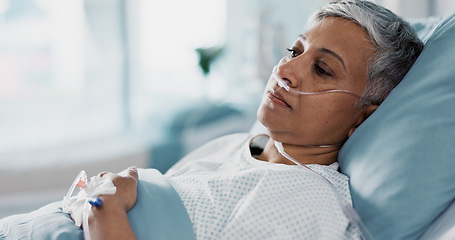 Image showing Sick, iv drip and senior woman in the hospital for consultation, surgery or treatment. Healthcare, recovery and elderly female patient resting in bed after operation or procedure in a medical clinic.