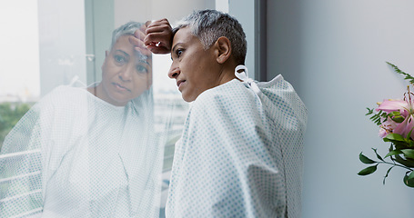 Image showing Sad, woman and thinking at window in hospital with stress, anxiety or fear of cancer, death or insurance. Senior, patient and depression in clinic with lady worried for future or mental health