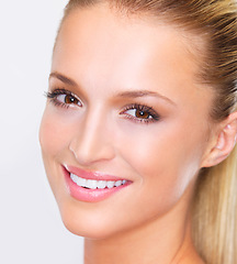 Image showing Beauty, woman and portrait with smile and white background, cosmetics and makeup in studio. Confidence, skincare and female model with skin glow and wellness from facial treatment and dermatology