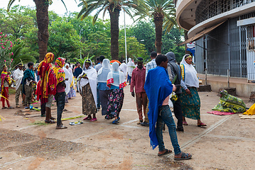 Image showing Celebrating Easter in Bahir Dar, Ethiopia. Men and women fill the streets, with women adorned in white scarves, reflecting the cultural traditions and festive atmosphere of the occasion.