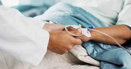 Image showing Holding hands, support and doctor with patient with iv drip in medical emergency hospital or clinic bed for medicine. Professional, healthcare and surgeon consulting person in surgery with care