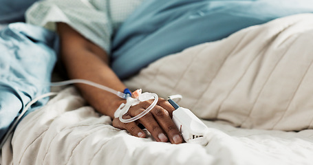 Image showing Iv drip, emergency and hand of patient in a hospital after surgery, treatment and operation in a clinic sleeping. Closeup, healthcare and person in medical ER for recovery, life support and medicine