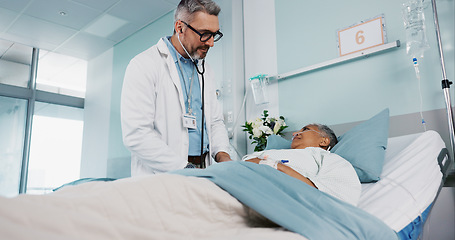 Image showing Doctor exam, hospital and stethoscope with a patient for cardiology, healthcare and heart problem. Ward, nursing and a medical employee listening to heartbeat of a woman for a consultation or service