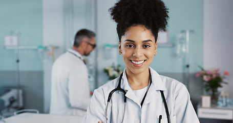 Image showing Hospital, doctor and face of woman with crossed arms for medical service, care and insurance. Healthcare, professional and portrait of person smile for consulting, medicine and medicare in clinic
