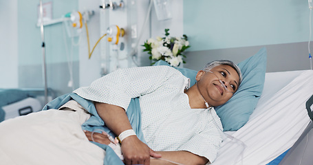 Image showing Healthcare, sick and senior woman in the hospital for consultation, surgery or treatment. Medical, recovery and elderly female patient resting in bed on iv drip after operation or procedure in clinic