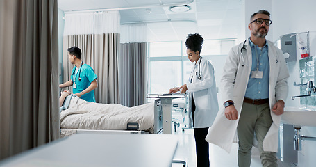 Image showing Medicine, hospital and a healthcare team of doctors checking on a patient in recovery or rehabilitation. Medical, teamwork and consulting with a group of health professionals in a clinic for wellness