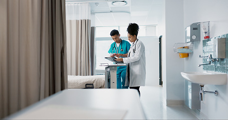 Image showing Doctor, team and nurse in discussion on tablet, planning and communication in hospital with bag. Technology, medical professional workers and people research healthcare online, wellness or telehealth