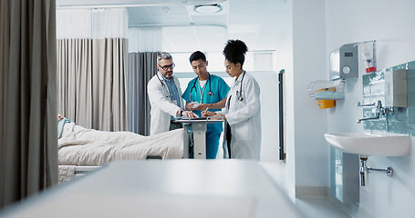 Image showing Healthcare, hospital and a medical team of doctors checking on a patient in recovery or rehabilitation. Medicine, teamwork and consulting with a group of health professionals in a clinic for wellness