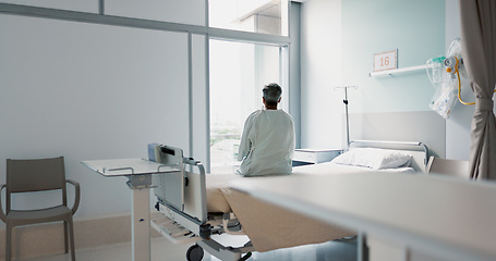Image showing Back, healthcare and a woman on a hospital bed by the window in recovery or waiting for a visit. Medical, cancer and a patient thinking about the future of medicine in a health clinic for treatment