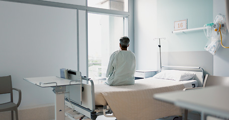 Image showing Back, healthcare and a woman on a hospital bed by the window in recovery or waiting for a visit. Medical, cancer and a patient thinking about the future of medicine in a health clinic for treatment