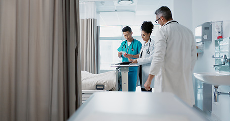 Image showing Healthcare, hospital and a medical team of doctors checking on a patient in recovery or rehabilitation. Medicine, teamwork and consulting with a group of health professionals in a clinic for wellness