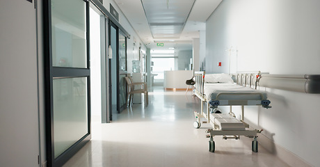 Image showing Healthcare, hospital and empty hallway with bed for medical care, health insurance and help in surgery. ER, emergency and lobby at clinic with stretcher for wellness, service and support in medicine.