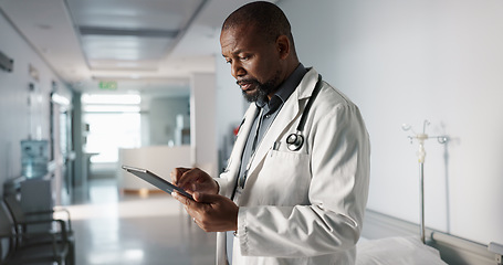 Image showing Doctor, hospital and tablet of healthcare information, typing and management of online charts or results. Healthcare worker or african person smile for service, planning or data on digital technology