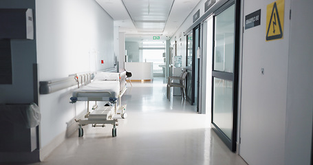 Image showing Healthcare, hospital and empty hallway with bed for medical care, health insurance and help in surgery. ER, emergency and lobby at clinic with stretcher for wellness, service and support in medicine.