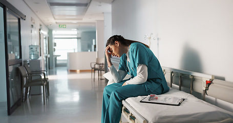 Image showing Stress, sad and loss with a woman nurse in hospital after a fail, mistake or error in healthcare treatment. Depression, anxiety and grief with a young medicine professional in a medical clinic