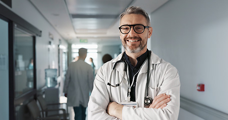 Image showing Doctor in portrait, senior man with arms crossed and healthcare, smile with confidence at hospital with pride and help. Medical professional, trust and happy at clinic with expert and stethoscope