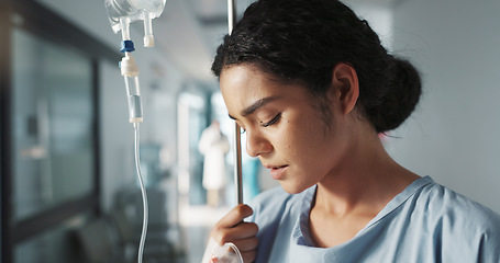 Image showing Sad, breathing and a woman with an iv drip at hospital for medicine, wellness and recovery from virus. Depression, thinking and a clinic patient with treatment stress, burnout or anxiety while sick