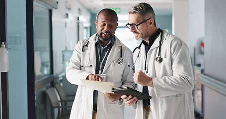 Image showing Doctors, teamwork and advice with documents, hospital folder and patient charts for healthcare planning or solution. Professional men with file, digital tablet and medical information or clinic data