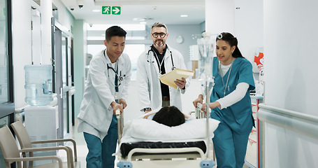 Image showing Doctors, people talking and push patient hospital bed, consulting and feedback on medicine treatment, support or ICU surgery. Teamwork, conversation and walking team, nurses or surgeon helping client