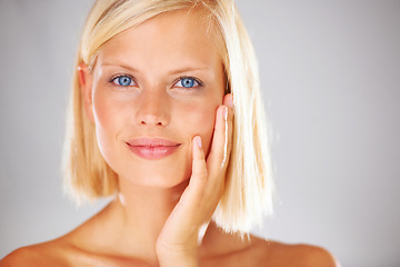 Image showing Beauty, studio portrait and woman feeling skin texture, dermatology results or facial cosmetics treatment, makeup or foundation. Clean spa face, headshot and aesthetic model girl on white background