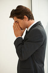 Image showing Stress, anxiety and business man in office with fear, worry or desperate prayer for help on wall background. Nervous, mistake and profile of male manager with headache for startup, disaster or fail