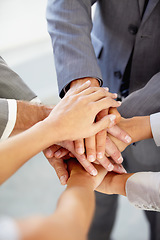 Image showing Hands, collaboration and a business team in a huddle at the office together from above for unity or solidarity. Teamwork, support or circle with an employee group of men and woman in a workplace