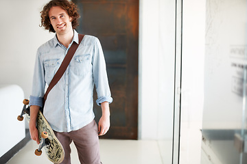 Image showing Man, smile in portrait with skateboard in office and sustainable, worker carbon footprint, transportation and creative at startup. Happy, skater for eco friendly travel and professional at workplace