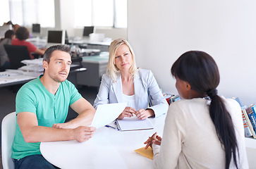Image showing Business people, job interview and paper for startup career and manager in meeting at tech company. Professional clients or employer with documents, resume or CV for information technology onboarding