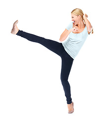 Image showing Woman, fight and kick a leg in air with karate, action or movement on white background in studio. Foot, kicking and person in self defence training, class or fighter with energy for attack move