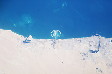 Image showing Earth, satellite and landscape, map of desert and Dubai, water and sand in environment, nature and geography. Aerial view, country and terrain, ocean or sea from space with city, island or coastline