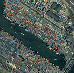 Image showing City, harbor and aerial of ship in dock for landscape, environment and boat on water. Geography, drone and satellite, top view and atmosphere of sea transport, nature and shipyard for distribution