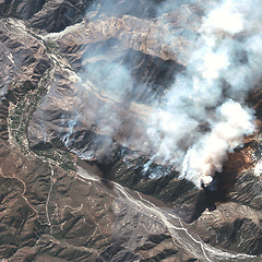 Image showing Location, aerial landscape and volcano with smoke, satellite image and mountain range with fog. Nature, background and view from above with map and topography, Earth and geography with aerospace