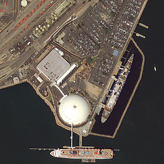 Image showing Ocean, harbor and aerial of earth with ships for landscape, environment and boating dock. Geography, nature and satellite, top view and drone of sea transport, distribution and shipyard for travel