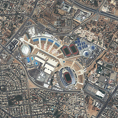 Image showing Aerial, state map and satellite view of landscape, nature and city outdoor with drone. Land, urban and stadium above with houses, neighborhood and roads with commercial development from top terrain