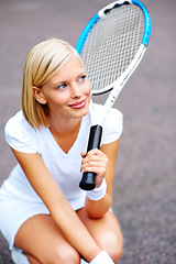 Image showing Tennis, woman and thinking with racket outdoor for training, contest and performance in competition. Happy young athlete, sports player and kneeling to daydream with bat for tournament game on court